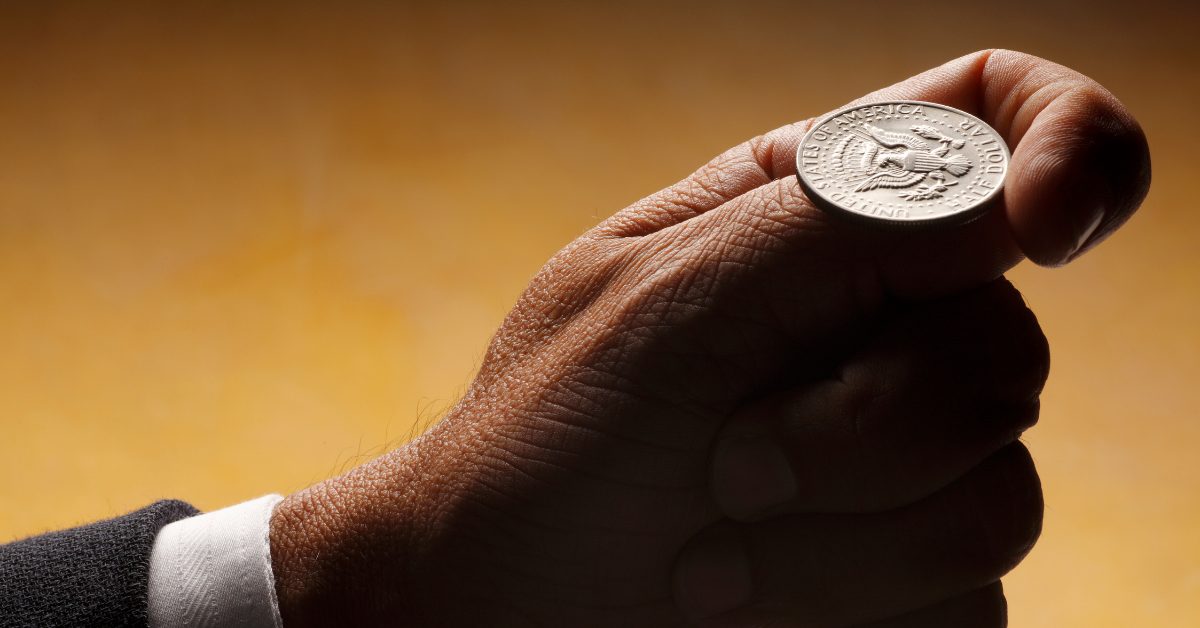 A coin beside the PHYLAX prototype during seed setup